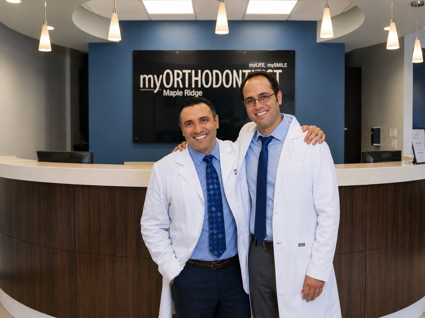 Dr. Alireza Haerian Ardekani and Dr. Aly Kanani standing together in the myORTHODONTIST Maple Ridge clinic